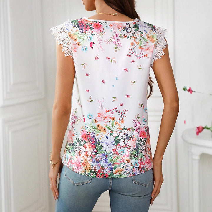 Damebluse med florale broderidetaljer og spidsærmer Stilla