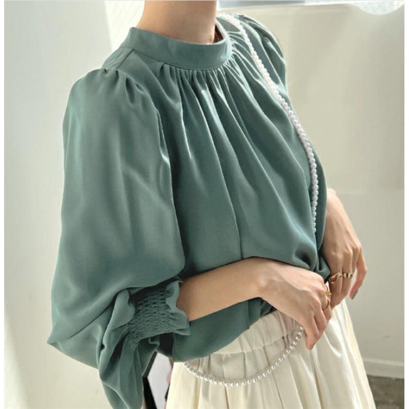 Kvindernes elegante bluse med voluminøse ærmer og opretstående krave Stilla