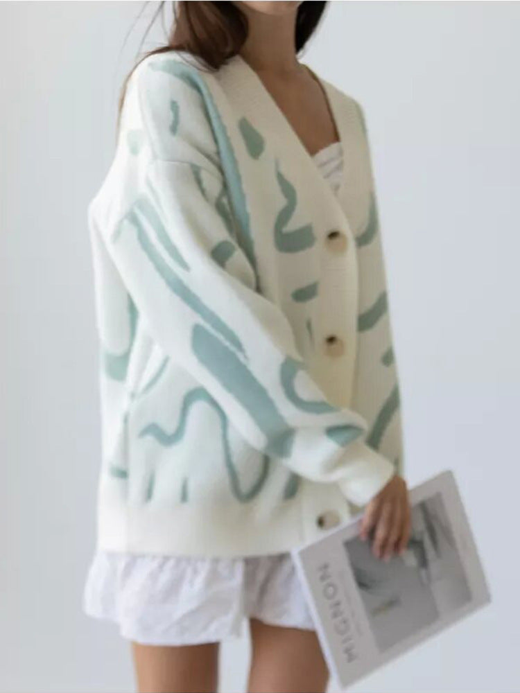 Dame cardigan med moderne mønster og elegante knapper