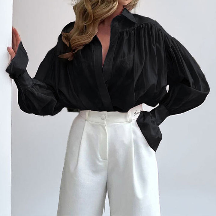 Kvindernes elegante bluse med løs pasform og ballonformede ærmer Stilla