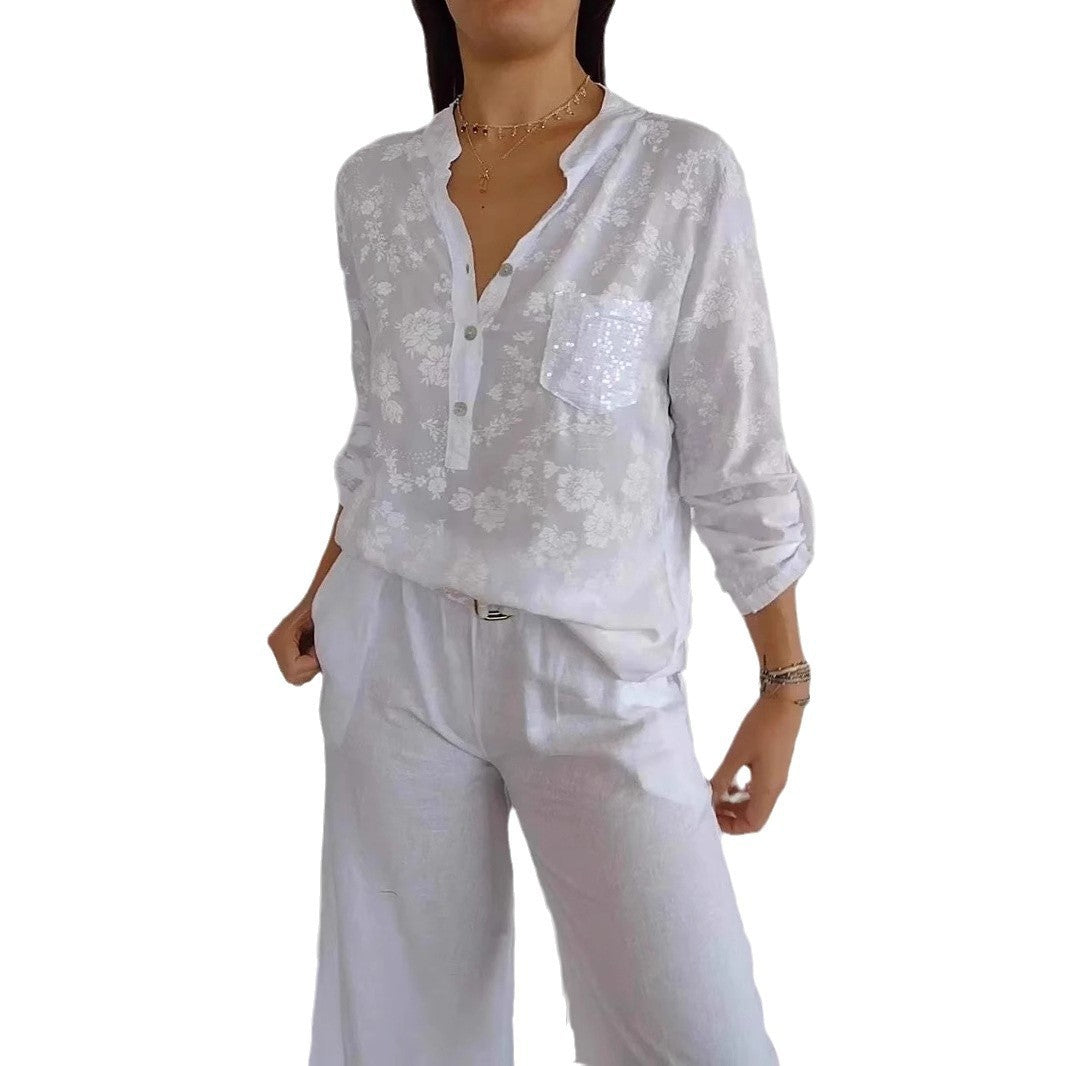 Damebluse med blomstret design og glitrende accenter Stilla