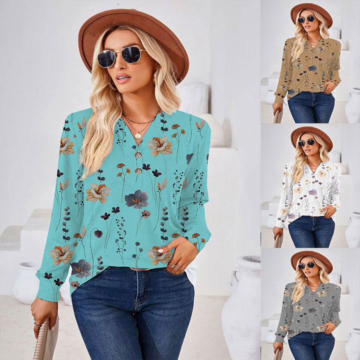 Damebluse med florale mønstre og moderne knapdetaljer Stilla