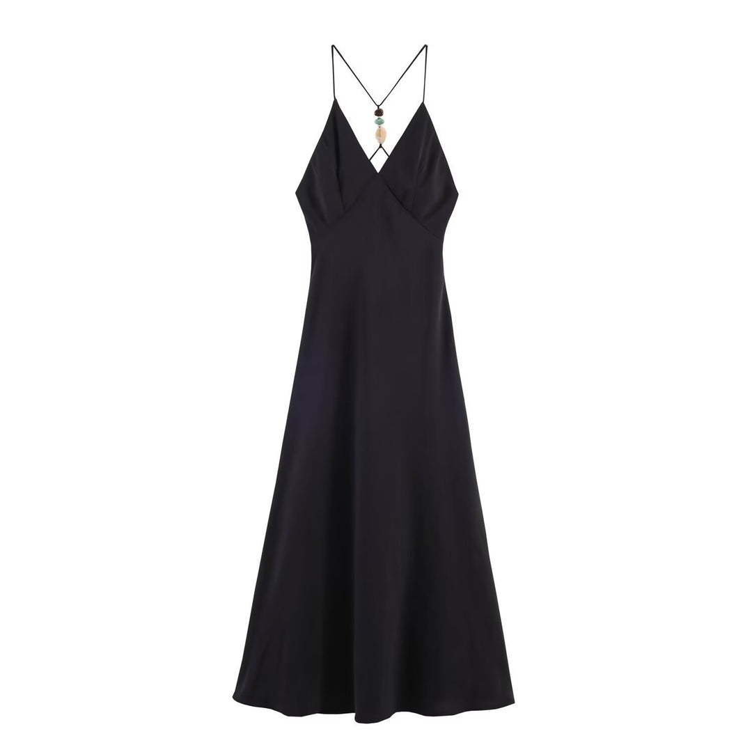 Dame maxikjole med delikat spaghetti-stropdesign og elegant drapering Skovae