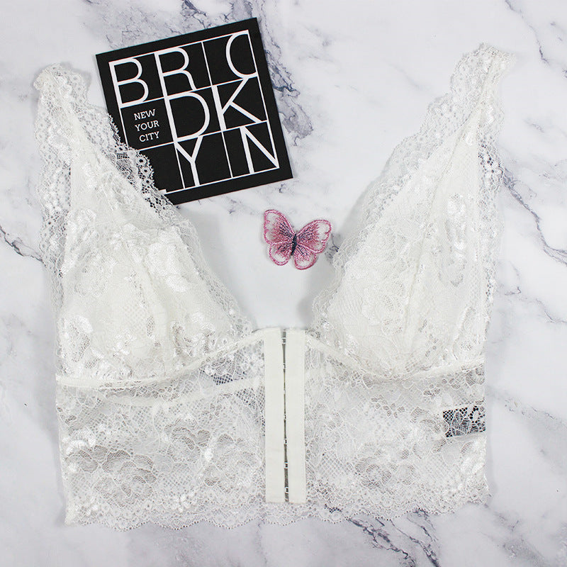 Dame spids-bustier med florale accenter og elastisk underbrystband Stilla