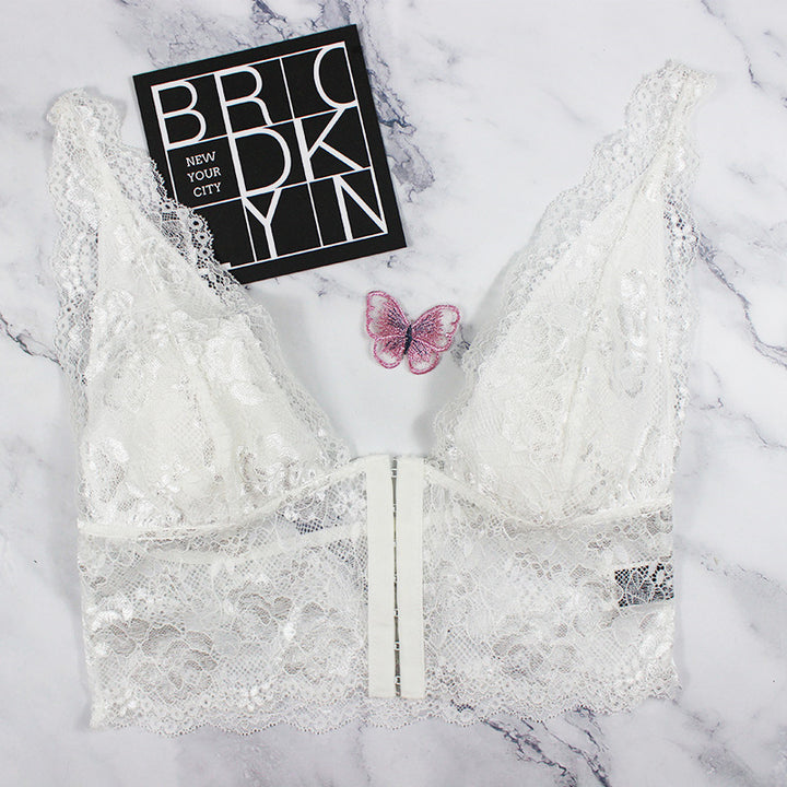 Dame spids-bustier med florale accenter og elastisk underbrystband Stilla