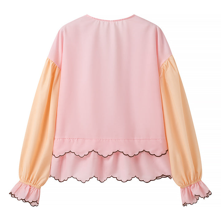 Damebluse med legende flæsedetaljer og elegant V-halsudskæring Stilla