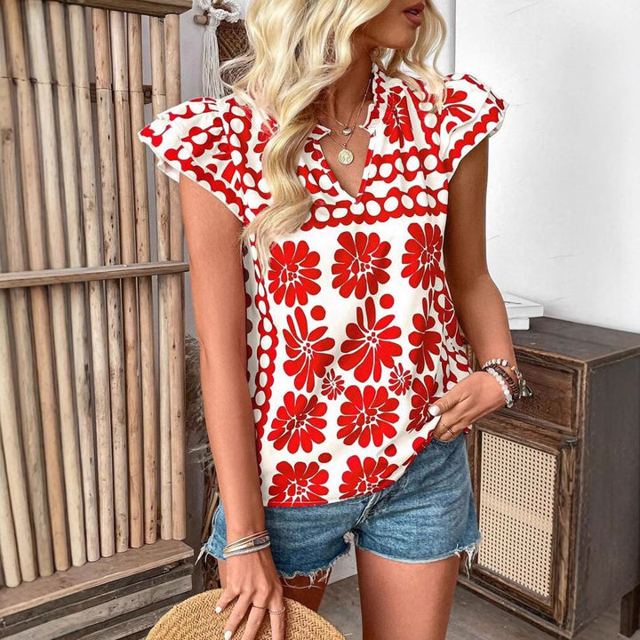 Damebluse med florale flæsedetaljer og frisk design Stilla