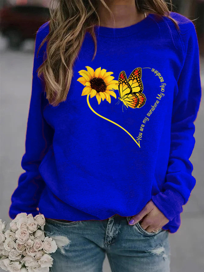 Kvinders sweatshirt med grafisk sommerfugl og solskinsmotiv Stilla
