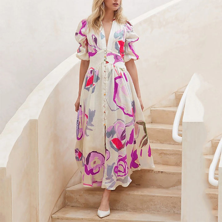 Dame Maxi-kjole med iøjnefaldende floralt design og volumetriske ærmer Stilla