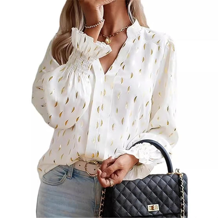 Damebluse med elegant guldmønster Stilla