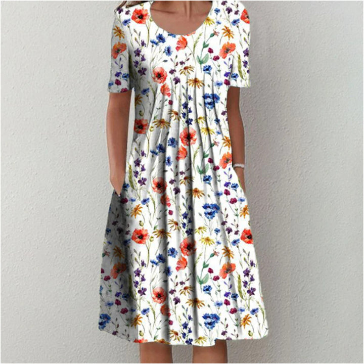 Dame fritidskjole med blomstret design og praktiske lommer Stiila