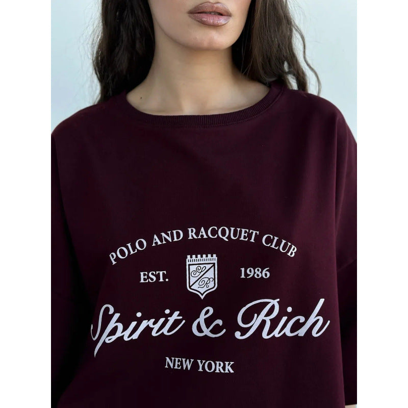 Dame Oversized T-shirt med afslappet polo-design og inspirerende statement Stilla