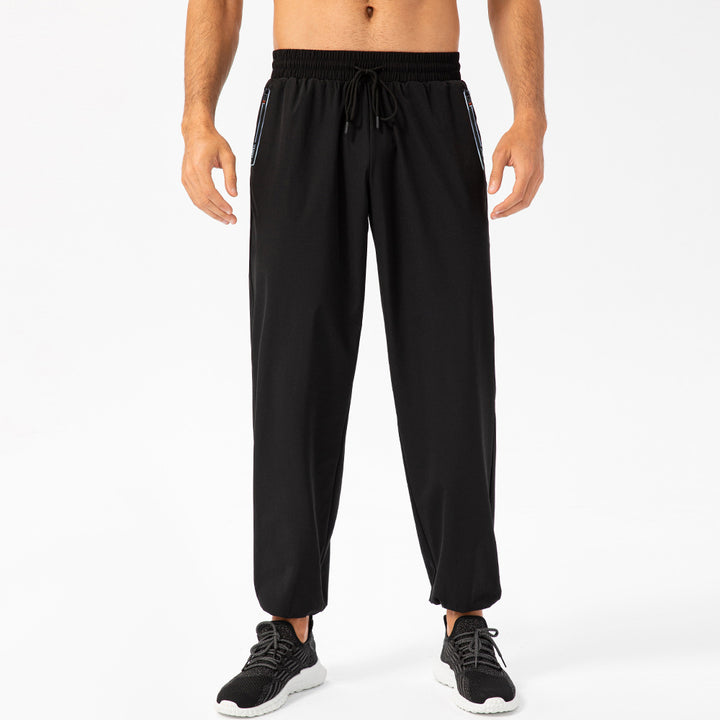 Herrer Sporty Joggingbukser med elastisk taljebånd og praktiske lynlåslommer Stilla