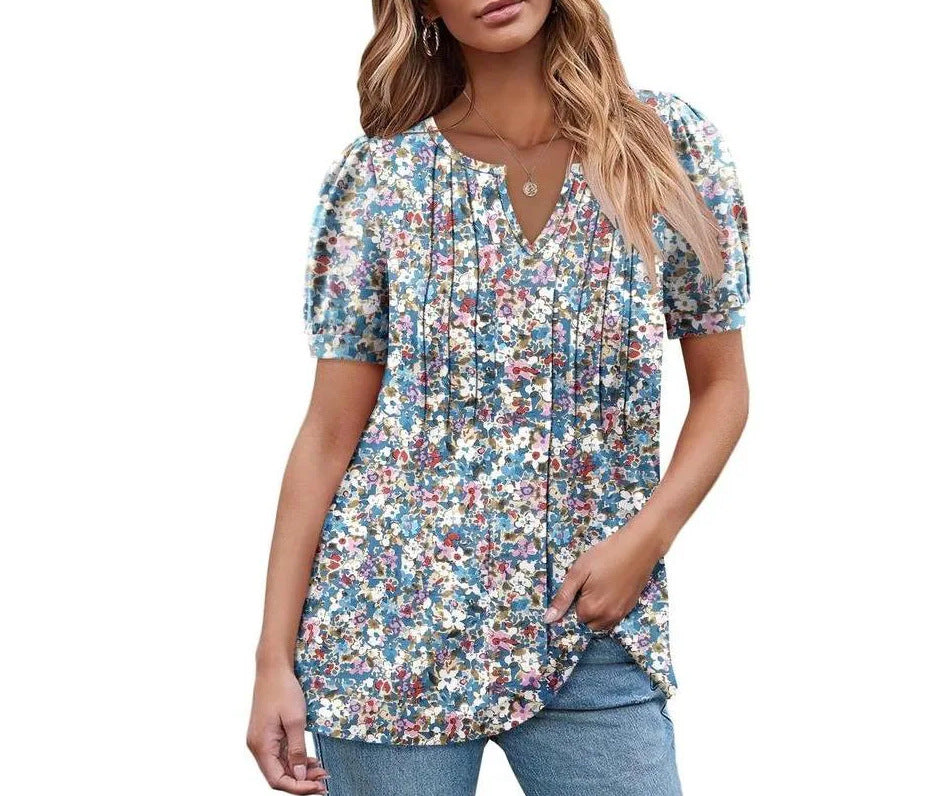 Damebluse med flæseærmer og blomsterdesign Stilla