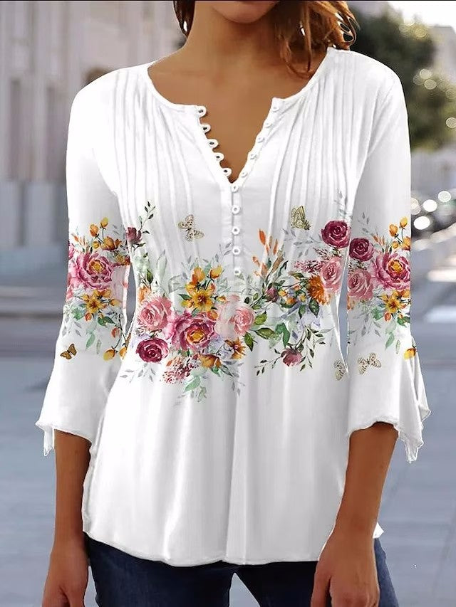 Damebluse med blomsterdesign og elegante knapdetaljer Stilla