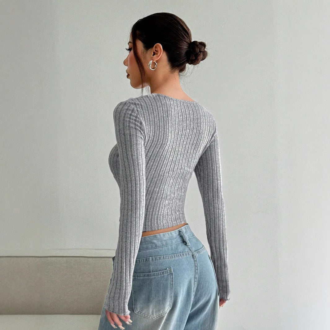 Kvindernes langærmede crop top med dyb V-hals og ribbet tekstur Stilla