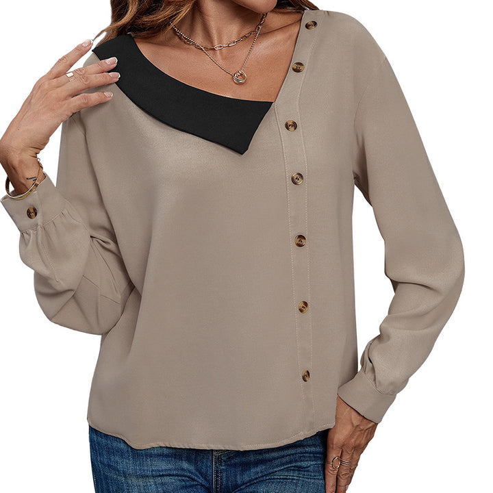Damebluse med asymmetrisk krave og dekorative knapdetaljer Stilla