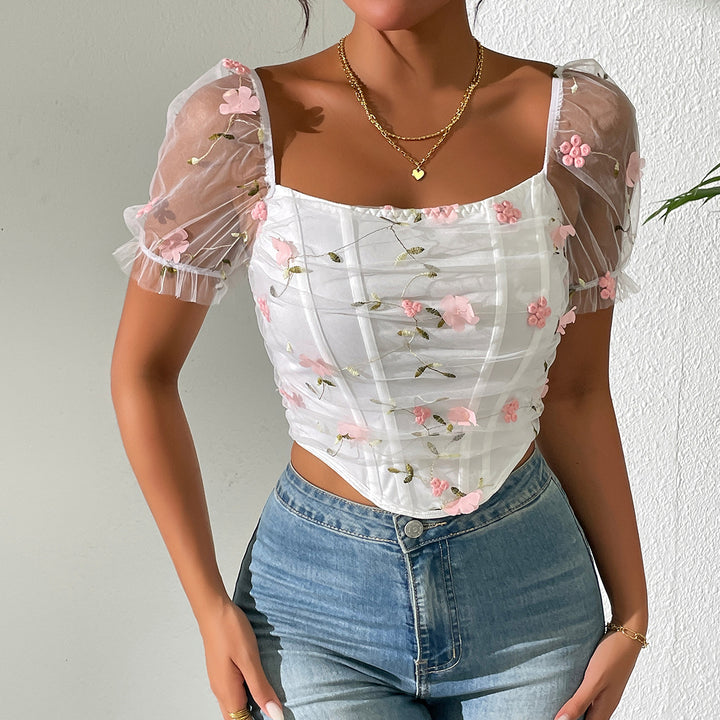 Damer elegant top med blomster-netærmer og flæsedetaljer Stilla