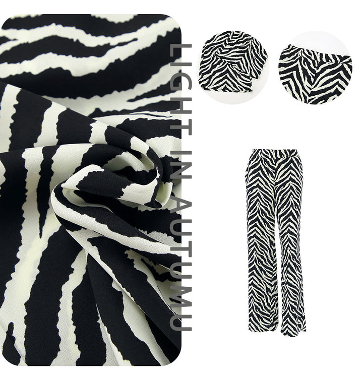 Dame bred Zebra-print Palazzo-bukser med elastisk talje og elegant snit Stilla