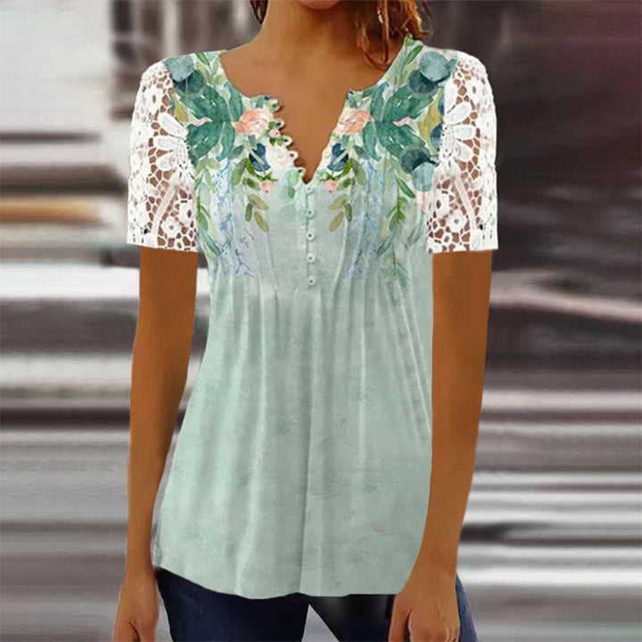 Damebluse med spidse ærmer og blomsterdesign Stilla
