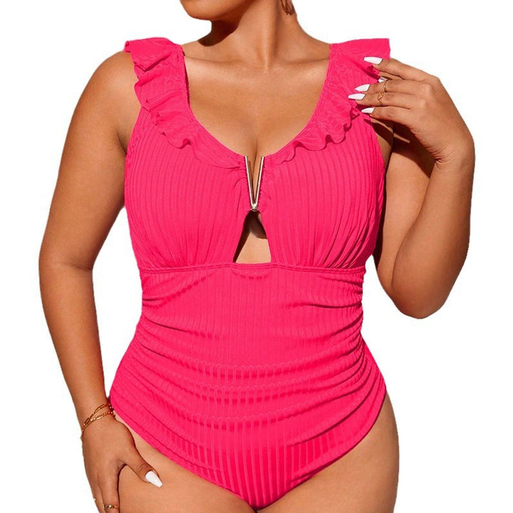 Dame one-piece badedragt med dekorative flæse detaljer og moderne cut-out.