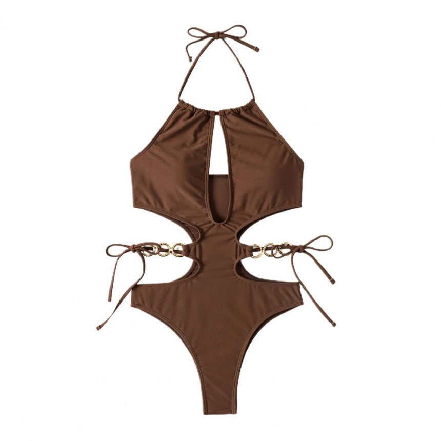Dame en-delt badedragt med sporty cut-out design og dekorative ringdetaljer Stilla