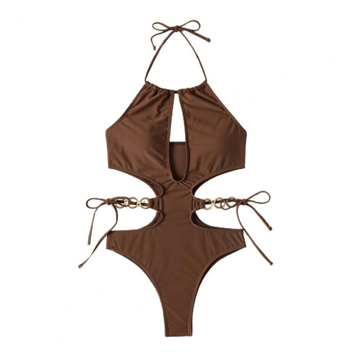 Dame en-delt badedragt med sporty cut-out design og dekorative ringdetaljer Stilla