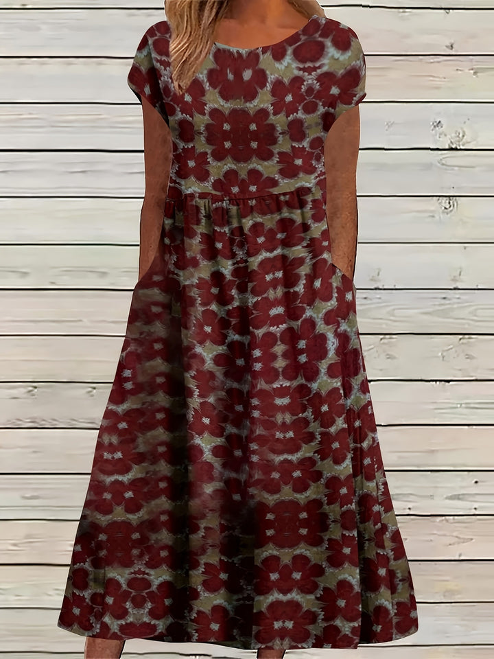 Dame Maxikjole med legende blomsterdesign og praktiske sidelommer Stilla