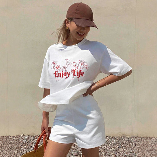 Dame Løs oversized T-shirt med blomsterprint og inspirerende tekst Skovae