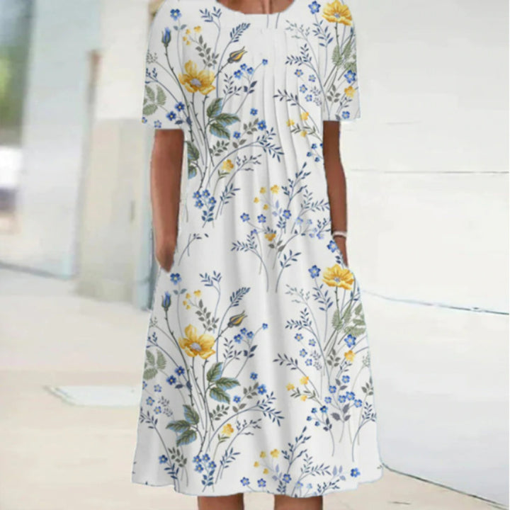 Dame fritidskjole med blomstret design og praktiske lommer Stiila