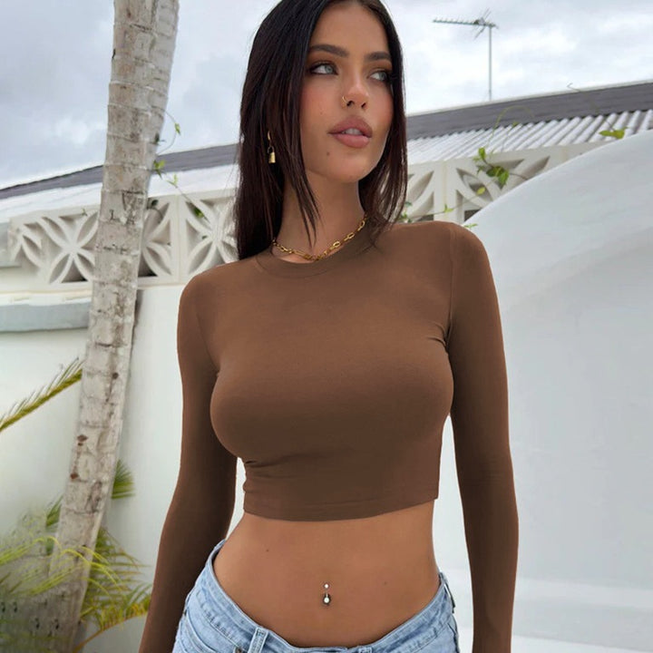 Dame tætsiddende langærmet crop-top med trendy snit og elastisk materiale Stilla