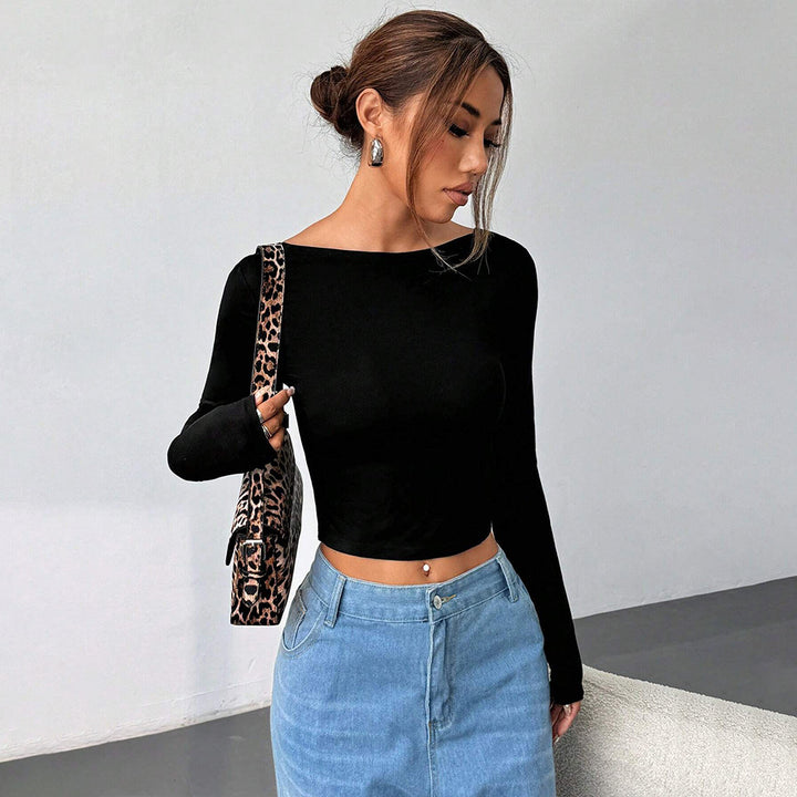 Kvinders langærmet crop top med elegant rund halsudskæring og figurvenlig pasform Stilla
