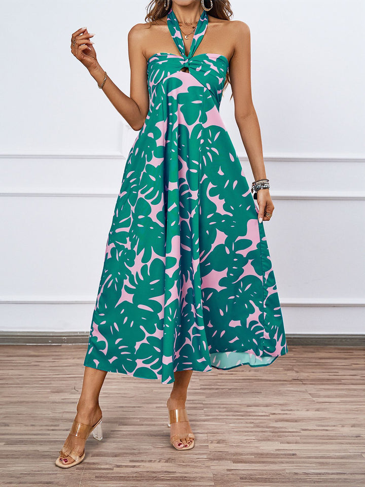 Dame maxikjole med skulderfri design og floral twist Stilla