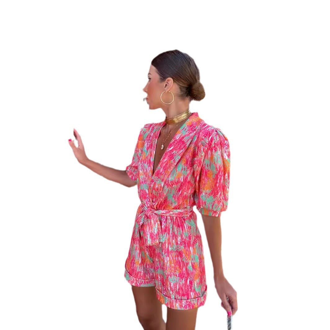 Kvinder Elegant Jumpsuit med Dyb V-Hals og Knapbar Bælte Skovae