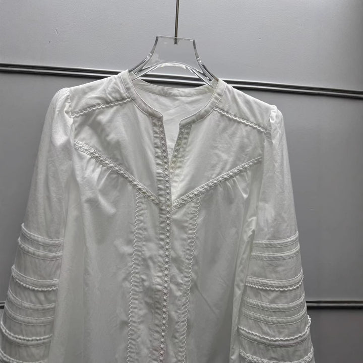Damebluse med elegante detaljer og broderede accenter Stilla