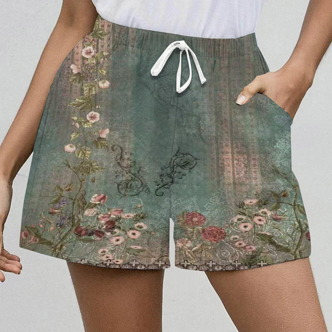 Dame shorts med blomsterprint og sidelommer Stilla