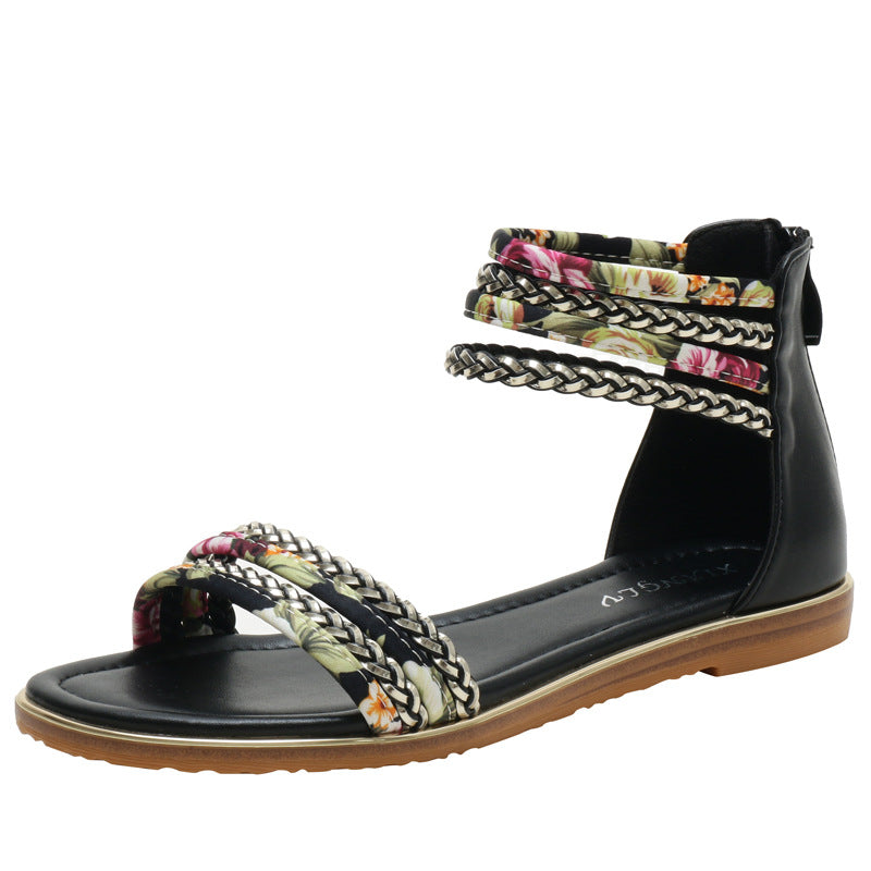 Dame fodsandaler med florale accenter og stilige flettede stropper Stilla