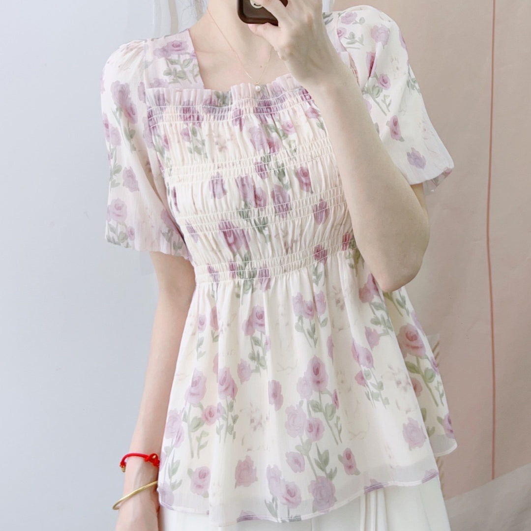 Damebluse med blomster smock-design og elastisk kant Stilla