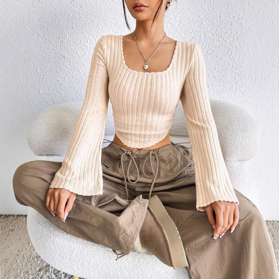 Kvinders langærmet crop top med dekorativ ribdesignet og afrundet bund Stilla