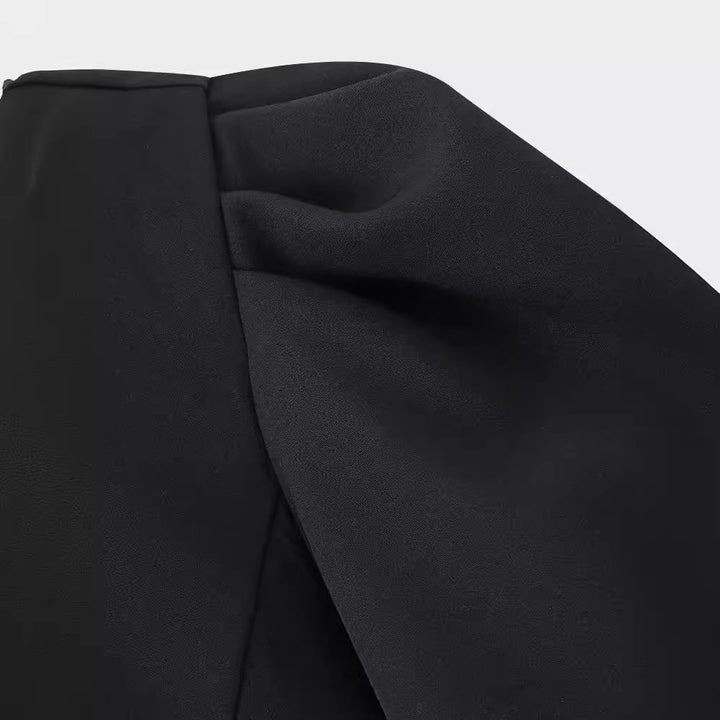 Damekjole med struktureret design og elegante sløjfeapplikationer Stilla