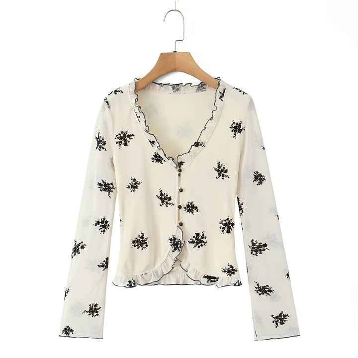 Damebluse med blomstret design og flæsedetaljer Stilla