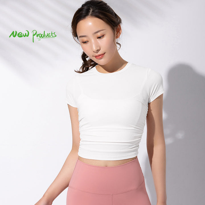 Dame sporty kortærmet crop-top med fashionable rynkeelementer og elastisk pasform Stilla