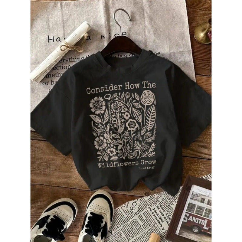 Dame T-shirt med florale motiv og inspirerende skrift Stilla