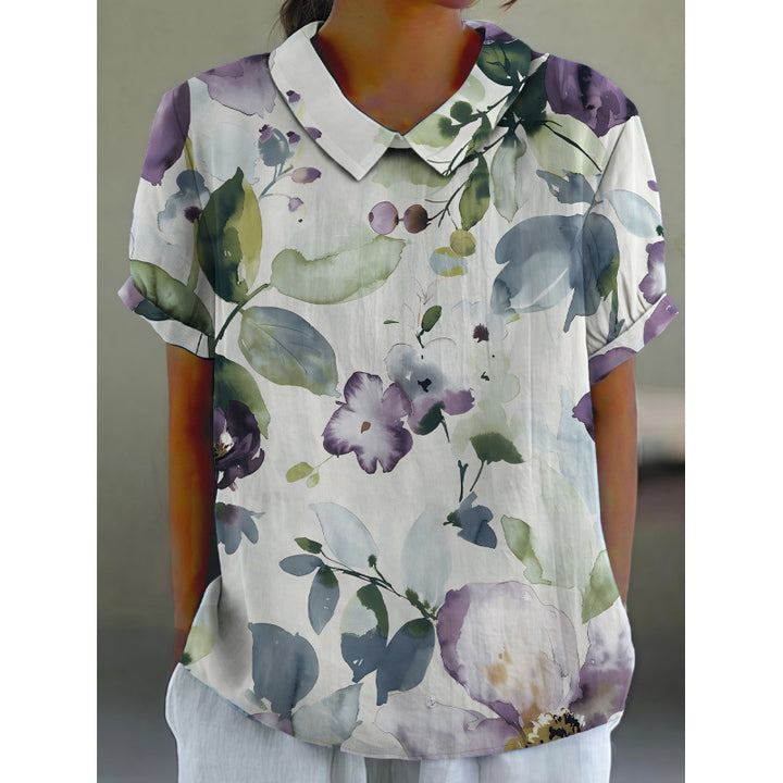 Dame kortærmet bluse med florale accenter og klassisk krave Skovae