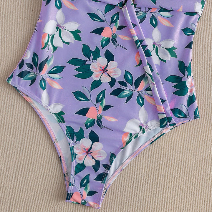 Dame one-piece badedragt med vingedetail og floral design Skovae