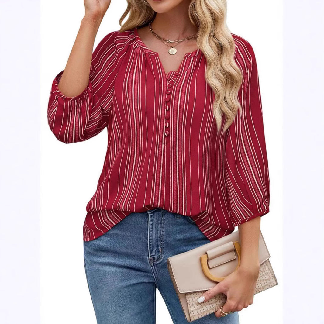 Damebluse med stribet design og elegante knapdetaljer Stilla