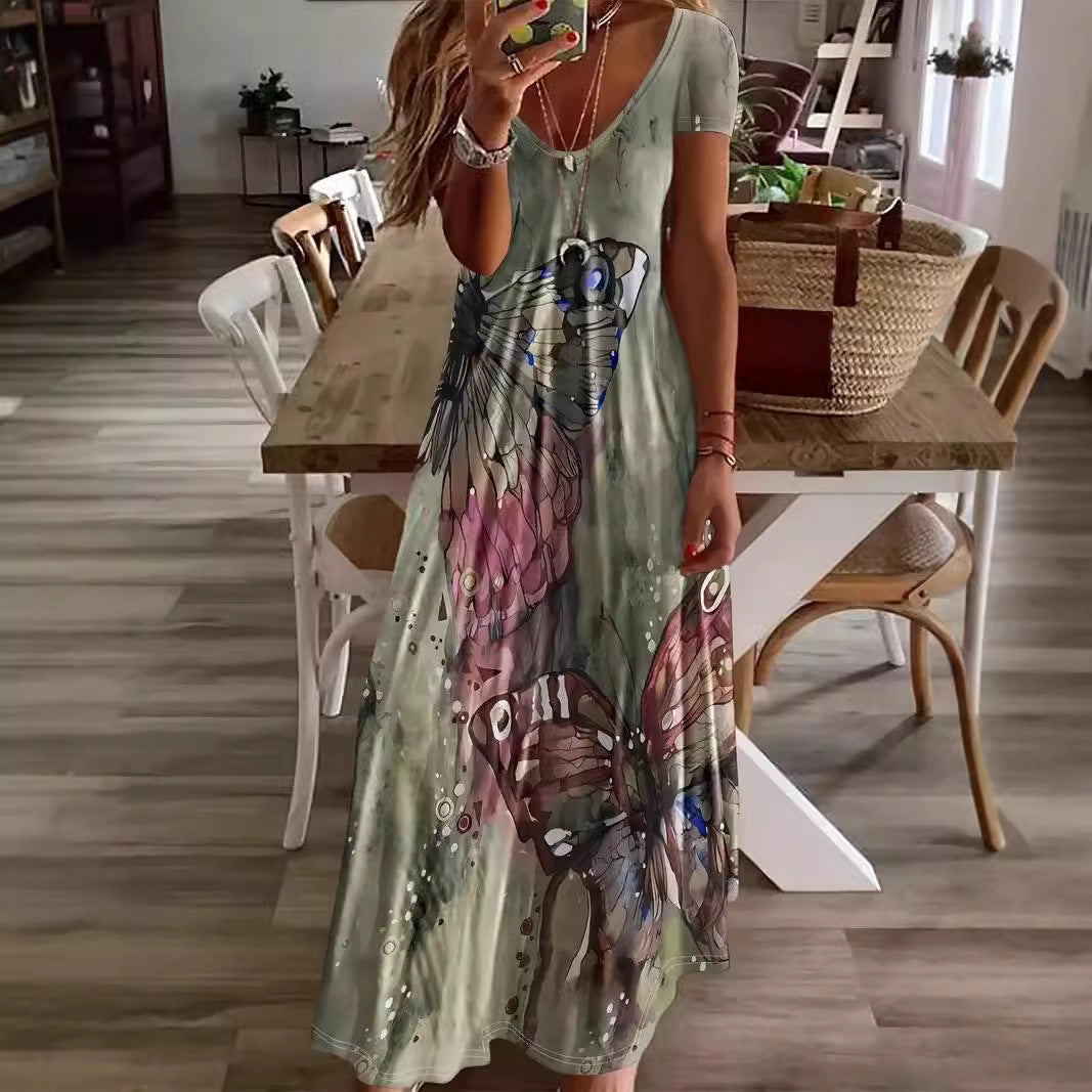 Dame Maxikjole med blomsteragtige sommerfuglemotiv og blødt flydende stof Stilla