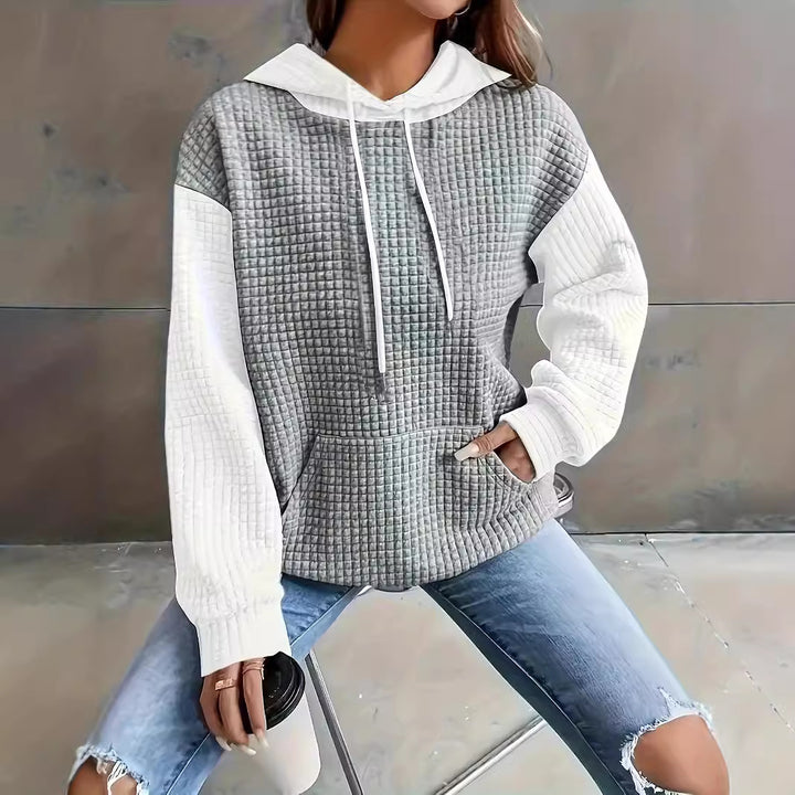 Dame hoodie med struktureret design og praktiske lommer Stilla