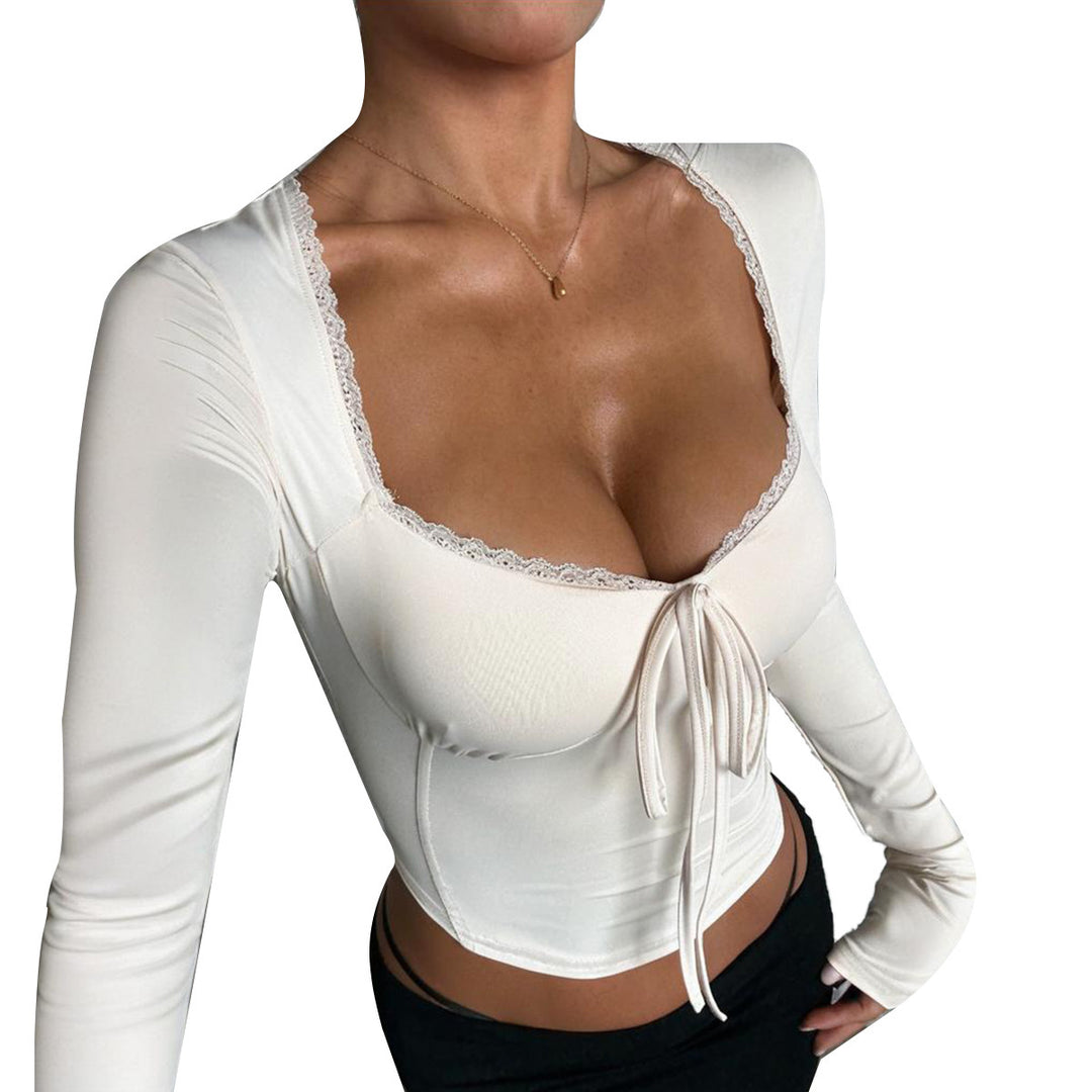 Kvindernes langærmede crop top med sofistikeret bånd og elegant udskæring