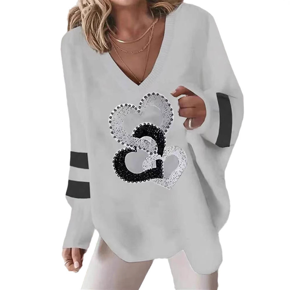 Dame hoodie med hjerte motiv og elegante kontraststriber Stilla